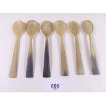 A set of six carved horn teaspoons