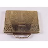 A Kigu gilt handbag form compact - boxed