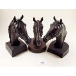 Three Heredities bronze finish horse heads by Doris Lindner, approx 19cm