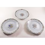 Three 19th century Faience floral painted plates - 23cm diameter