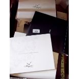 A box of watch marketing and sales catalogues for Patek Phillipe, Cartier and Breguet