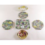 A small group of floral chintz china