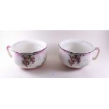 A pair of Edwardian floral chamber pots