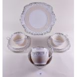 A Royal Stafford tea service in cream and gilt comprising: six cups and saucers, six tea plates,