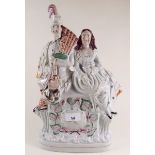 A Victorian flat back time piece figure group with Scotsman and woman - a/f