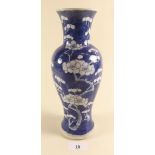 A Chinese baluster vase painted in the prunus pattern 26cm