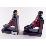 A pair of pottery bookends with Japanese figures