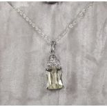 A yellow kunzite and white topaz pendant on silver chain