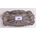 A silver rectangular trinket dish with embossed decoration and floral pierced border 17 x 9cm -