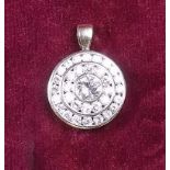 An 18ct gold Kutchinsky diamond set circular pendant - signed