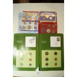 A quantity of coins in presentation packs including: USA set cent through to dollar 1998 UNC coin
