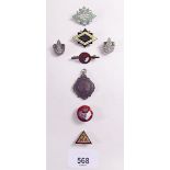 Seven various badges including Scouts