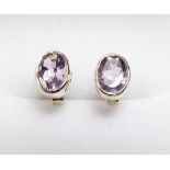 A pair of 9ct gold earrings set purple topaz