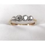 An 18ct gold four stone diamond ring, size M