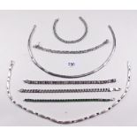 A selection of silver collars and bracelets