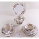 A Victorian 'Queens China' floral tea service comprising: twelve cups and saucers, eleven tea