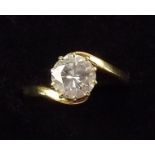 An 18ct gold crossover set large solitaire diamond ring - 1.47 carats, Si/2/P1 clarity, I/J