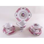 A Royal Albert Lady Carlyle part tea service comprising: six cups and saucers, five tea plates, cake