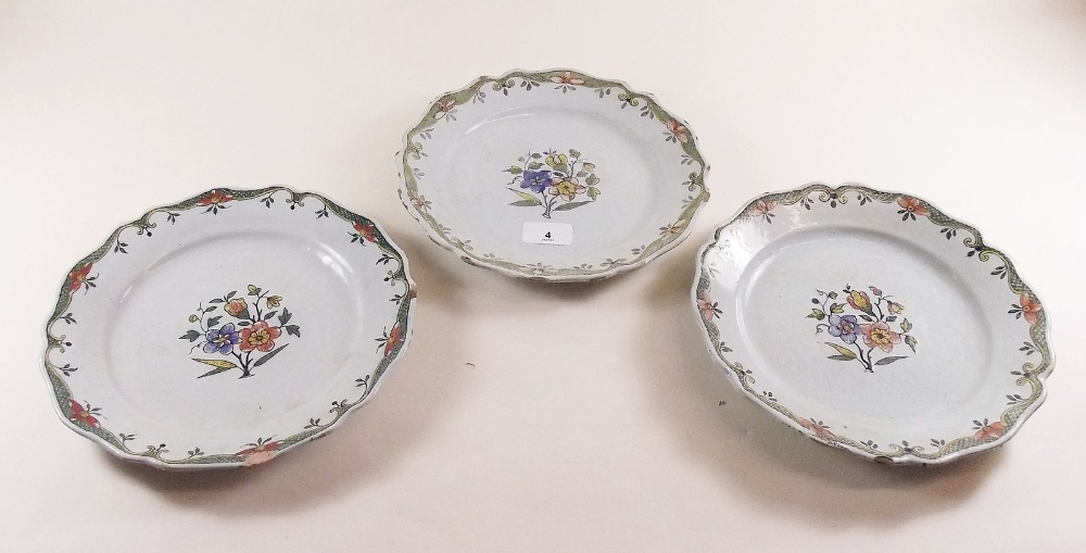 Three 19th century Faience floral painted plates - 23cm diameter