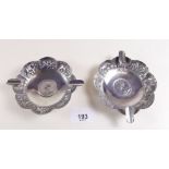 A pair of Indian sterling silver fluted ashtrays set one rupee 1919 coins to bases and with embossed