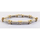 An 18ct white and yellow gold diamond bracelet with flower head and line set links, total weight 32g