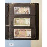 Folder of banknotes containing approx 40 notes, examples include: Biafra: shillings 5, 10, 2000