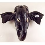 An ebony wall plaque in the form of an elephants head - 32cm high