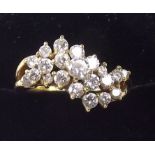 An 18ct gold ring set twenty one brilliant cut diamonds in wave formation , size N.