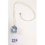 A 9ct gold pendant set sky blue topaz and chain