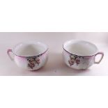 A pair of Edwardian floral chamber pots