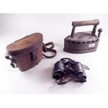 A Victorian Dalli box iron and a pair of WWII German binoculars in leather case