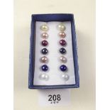 A box of pearl earrings