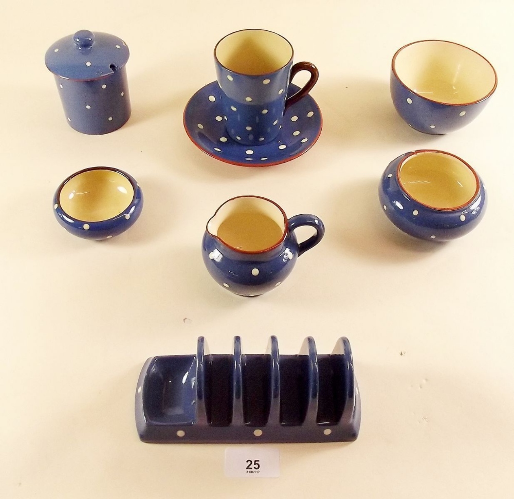 A Denby blue and white polka dot group of tea ware comprising: toast rack, cup and saucer,
