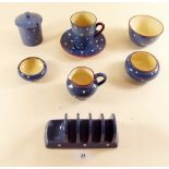 A Denby blue and white polka dot group of tea ware comprising: toast rack, cup and saucer,