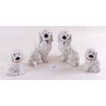 Two pairs of 20th century Staffordshire spaniels - 15cm and 10cm