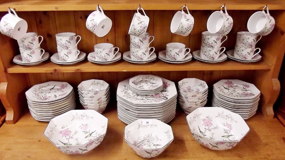 A fine Japanese Saji dinner service comprising: twelve dinner plates, twelve bowls, two large