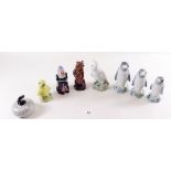 Eight Wade spirit flasks including a graduated set of three penguins