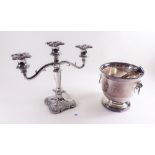 A silver plated ice bucket and tongs and a silver plated candelabra