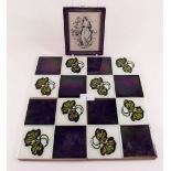 Four Victorian tiles and an early ceramic plaque with printed figure of charity a/f
