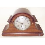 An Edwardian mahogany mantel clock with decorative inlay