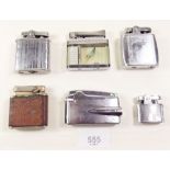 A collection of six old cigarette lighters