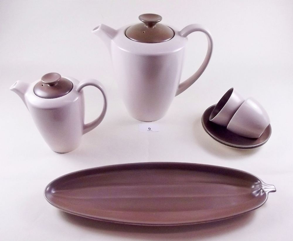 A Poole Pottery coffee set comprising two coffee pots, six cups and saucers, biscuit tray