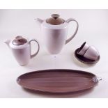 A Poole Pottery coffee set comprising two coffee pots, six cups and saucers, biscuit tray