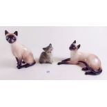 A pair of Doulton Siamese cats - HN2665, HN2667 and one other Doulton cat
