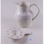 A Leeds creamware jug and tea strainer