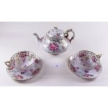 A tea service painted roses and gilt decoration, 5 cups and saucers, teapot, milk and sugar