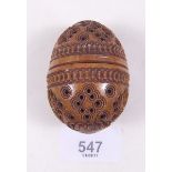 A Victorian carved treen pomander of egg form