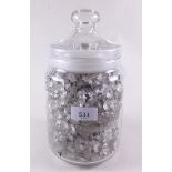 A jar of cut glass chandelier crystals