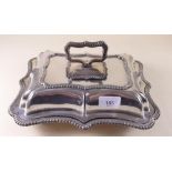 A silver plated entree dish