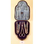 A pair of silver plated nutcrackers and grape scissors, cased